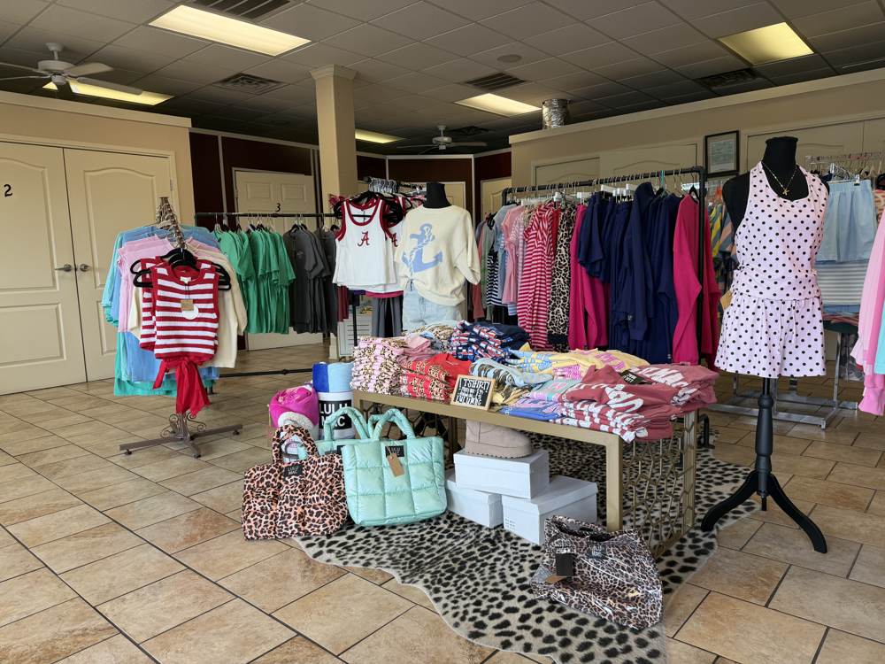 Bama Tan boutique sales floor with clothing racks and accessories